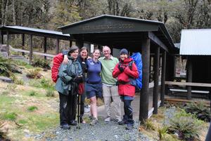 Margaret Mackenzie-Hooson (L) with her fellow travellers and guide at Lake Mackenzie Lodge on the Routeburn Track.